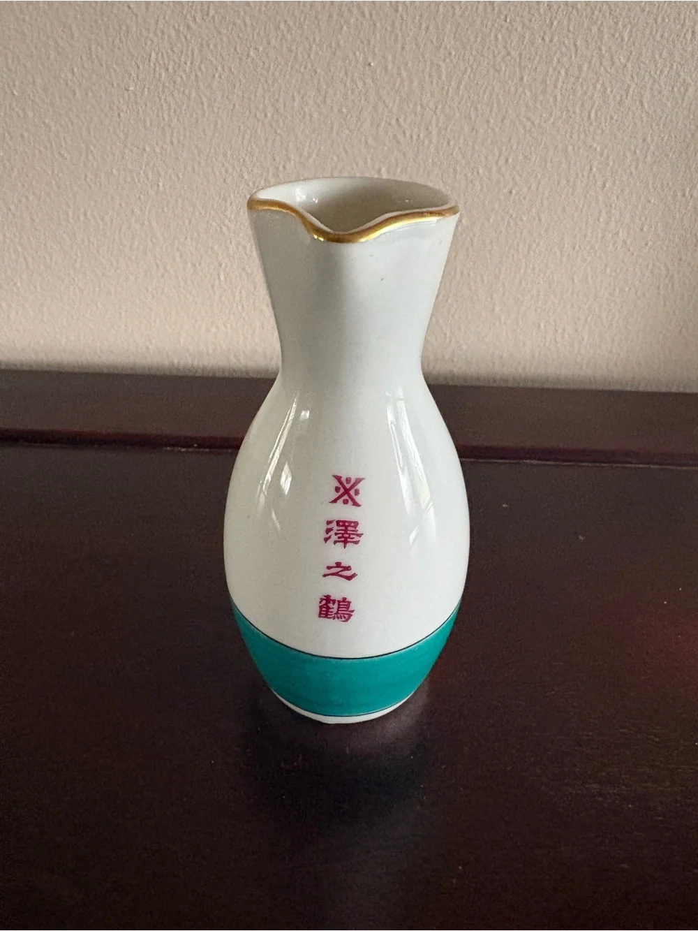 Japanese Sake bottle with gold trim. Sawanotsuru brewery